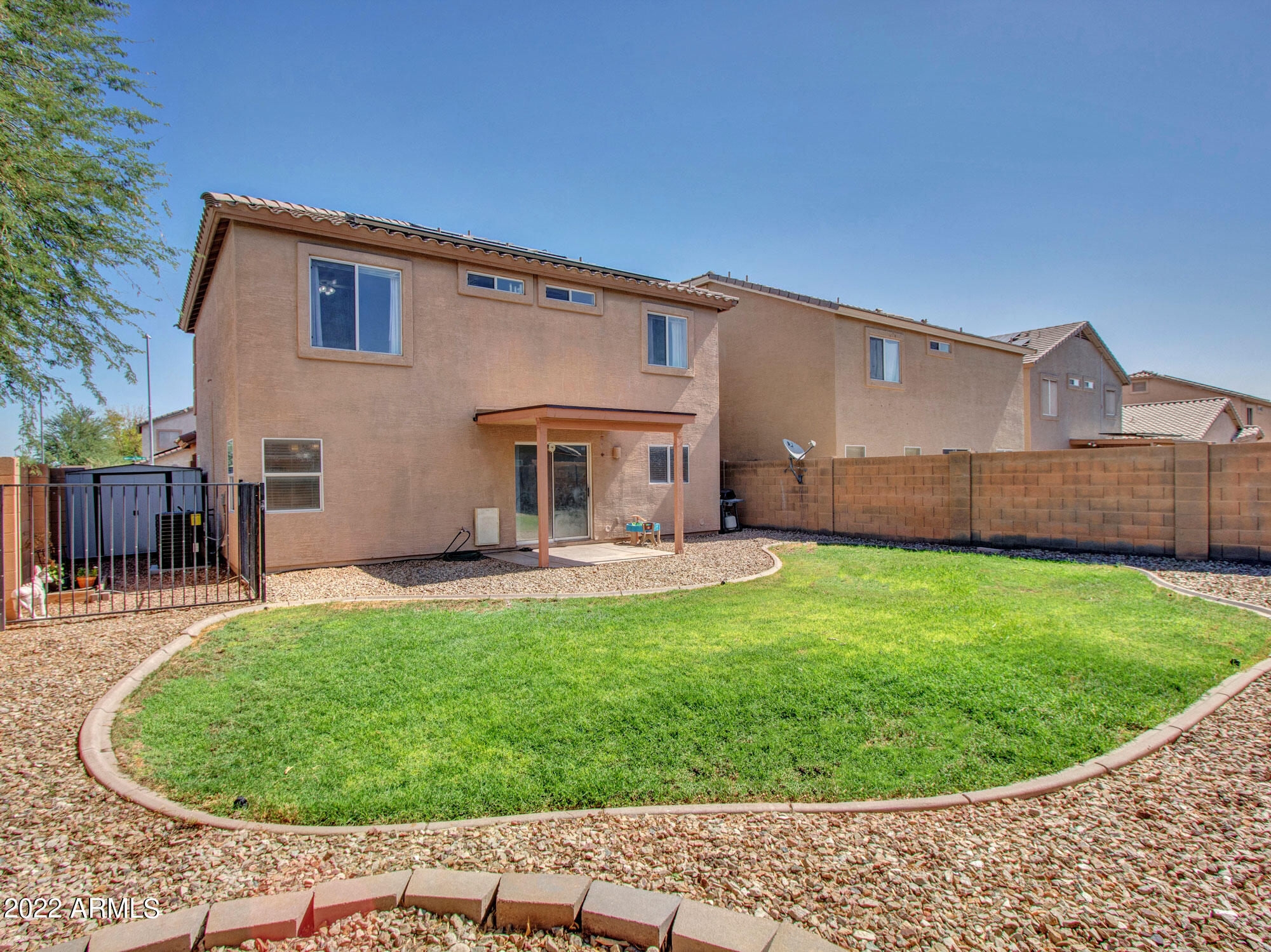 11645 West Mountain View Road Youngtown, AZ 85363 - Photo 39 of 45 a view of a house with a backyard