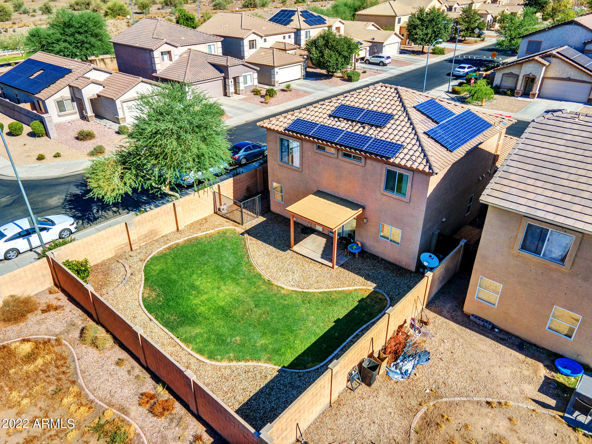 11645 West Mountain View Road Youngtown, AZ 85363 - Photo 4 of 45 an aerial view of a house with a garden and swimming pool