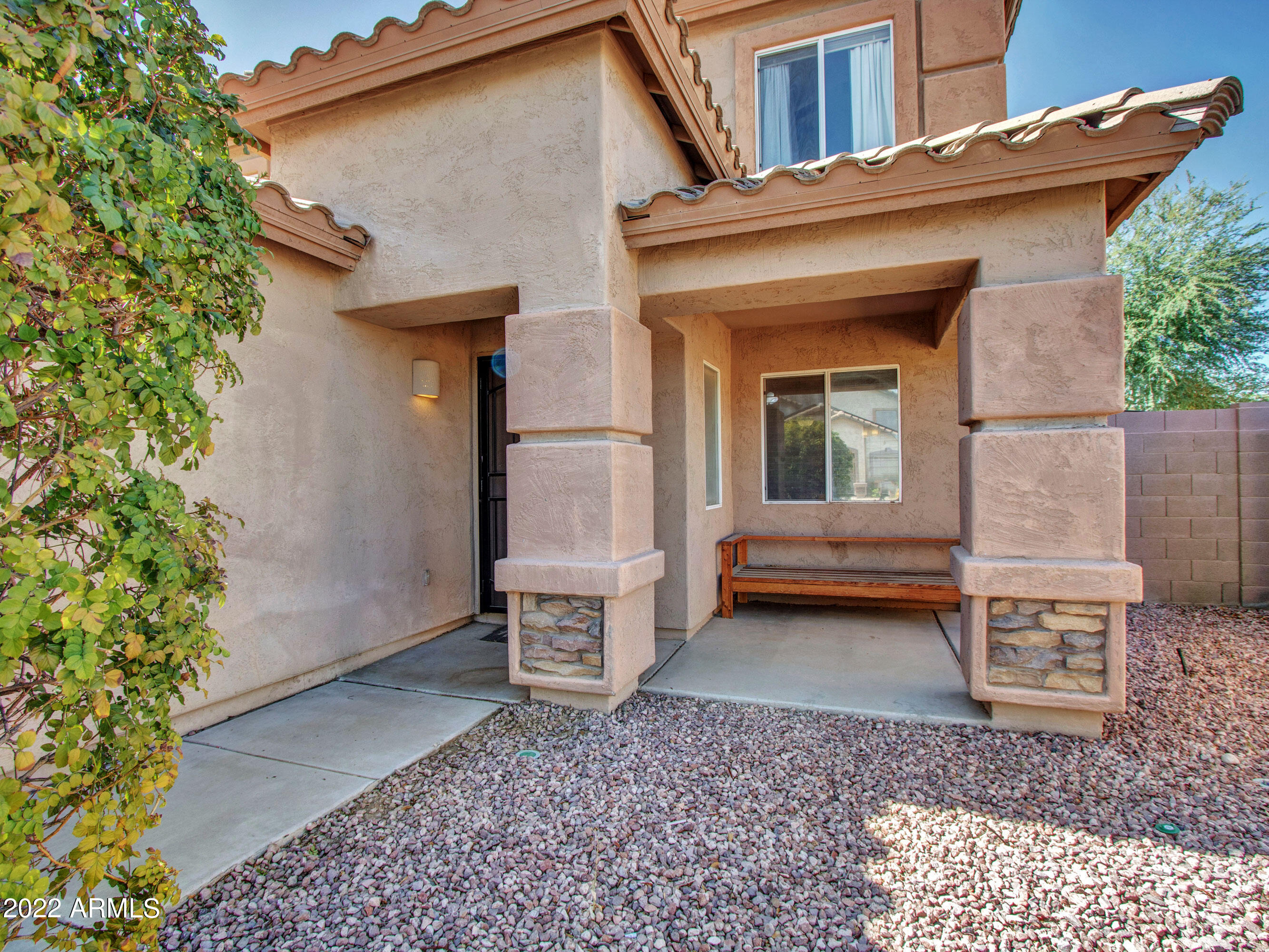 11645 West Mountain View Road Youngtown, AZ 85363 - Photo 6 of 45 a view of house with backyard and outdoor seating
