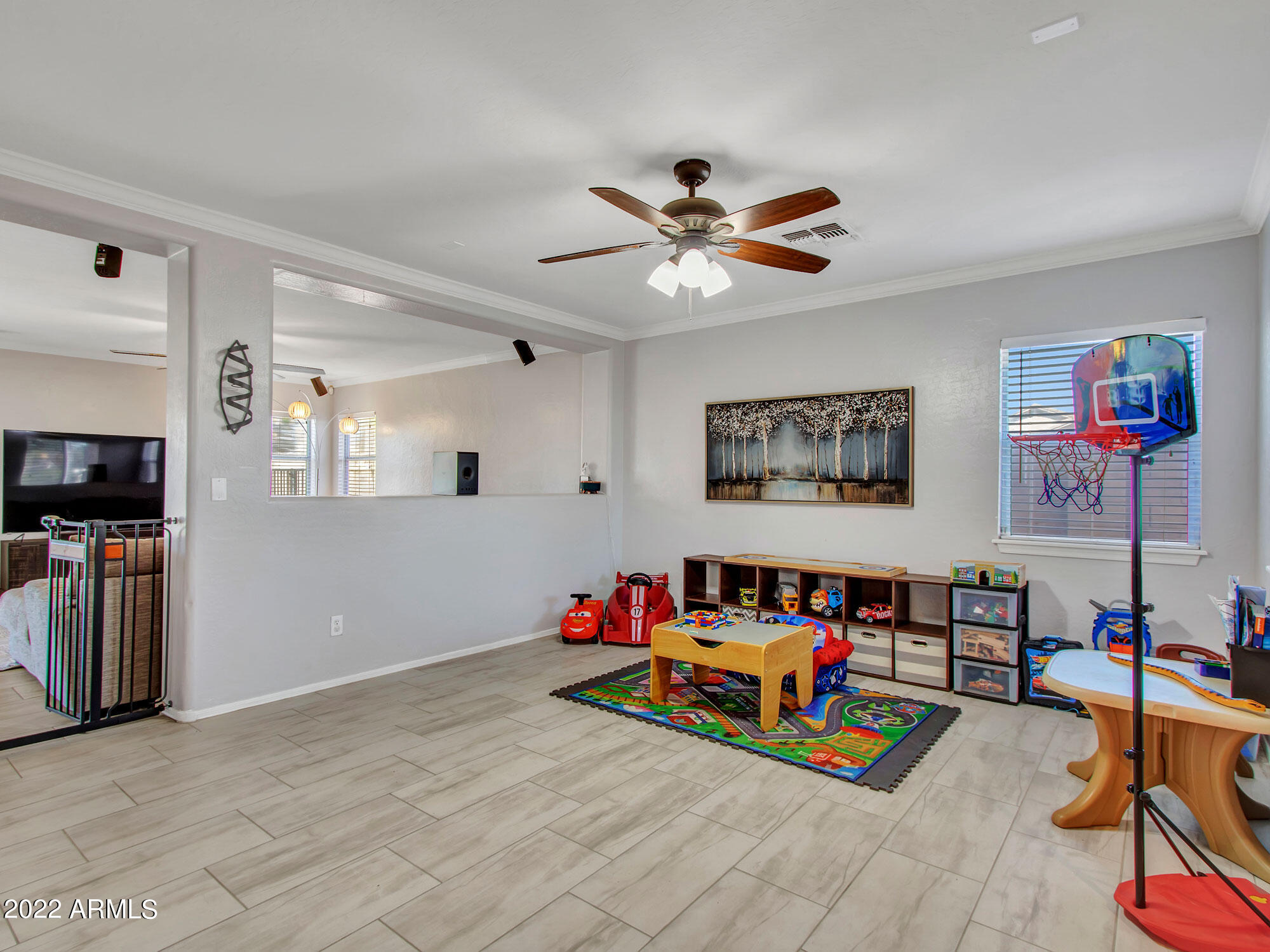 11645 West Mountain View Road Youngtown, AZ 85363 - Photo 9 of 45 a living room with furniture and a flat screen tv