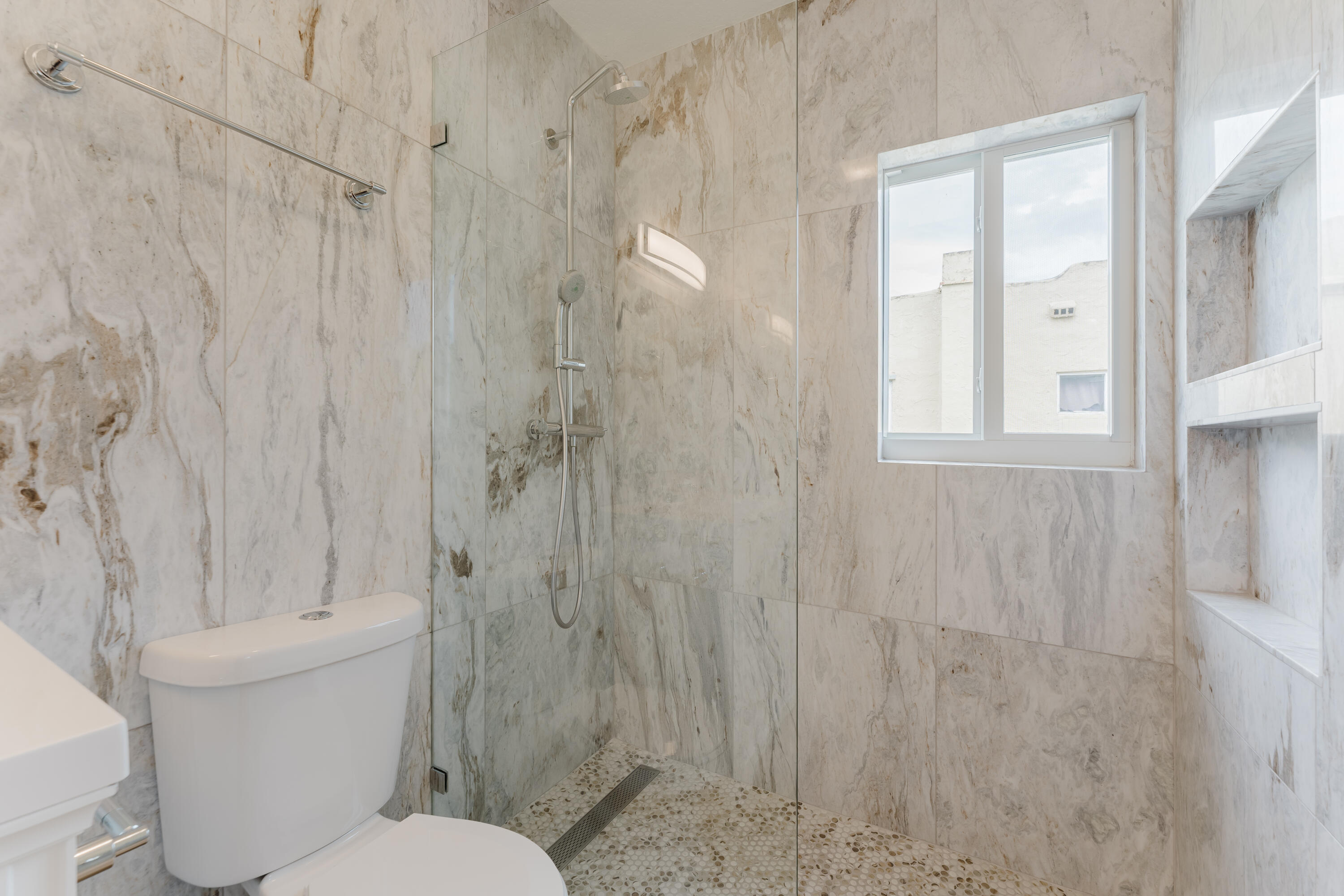 921 Ortega Road West Palm Beach, FL 33405 - Photo 15 of 60 a bathroom with a toilet and shower