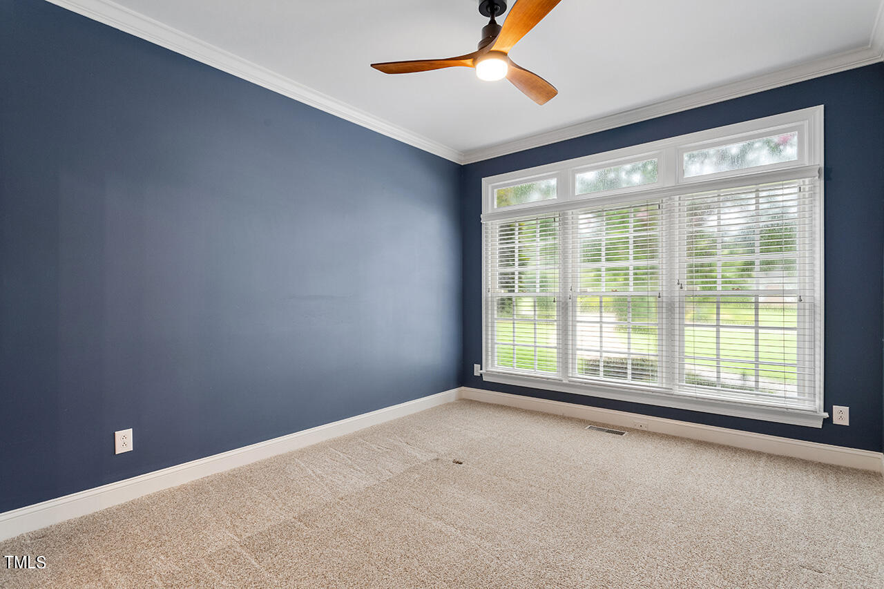 909 Rockfall Court Raleigh, NC 27614 - Photo 15 of 38 a view of an empty room with a window