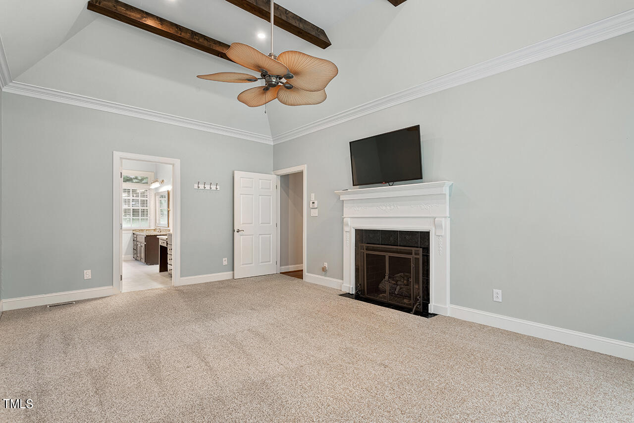 909 Rockfall Court Raleigh, NC 27614 - Photo 18 of 38 a view of a livingroom with an empty space and a fireplace