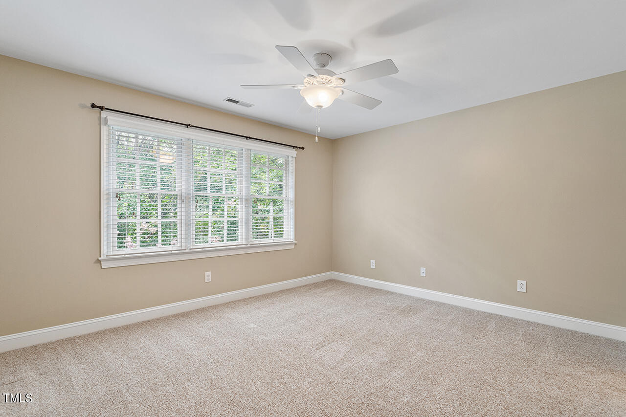 909 Rockfall Court Raleigh, NC 27614 - Photo 21 of 38 a view of an empty room with a window