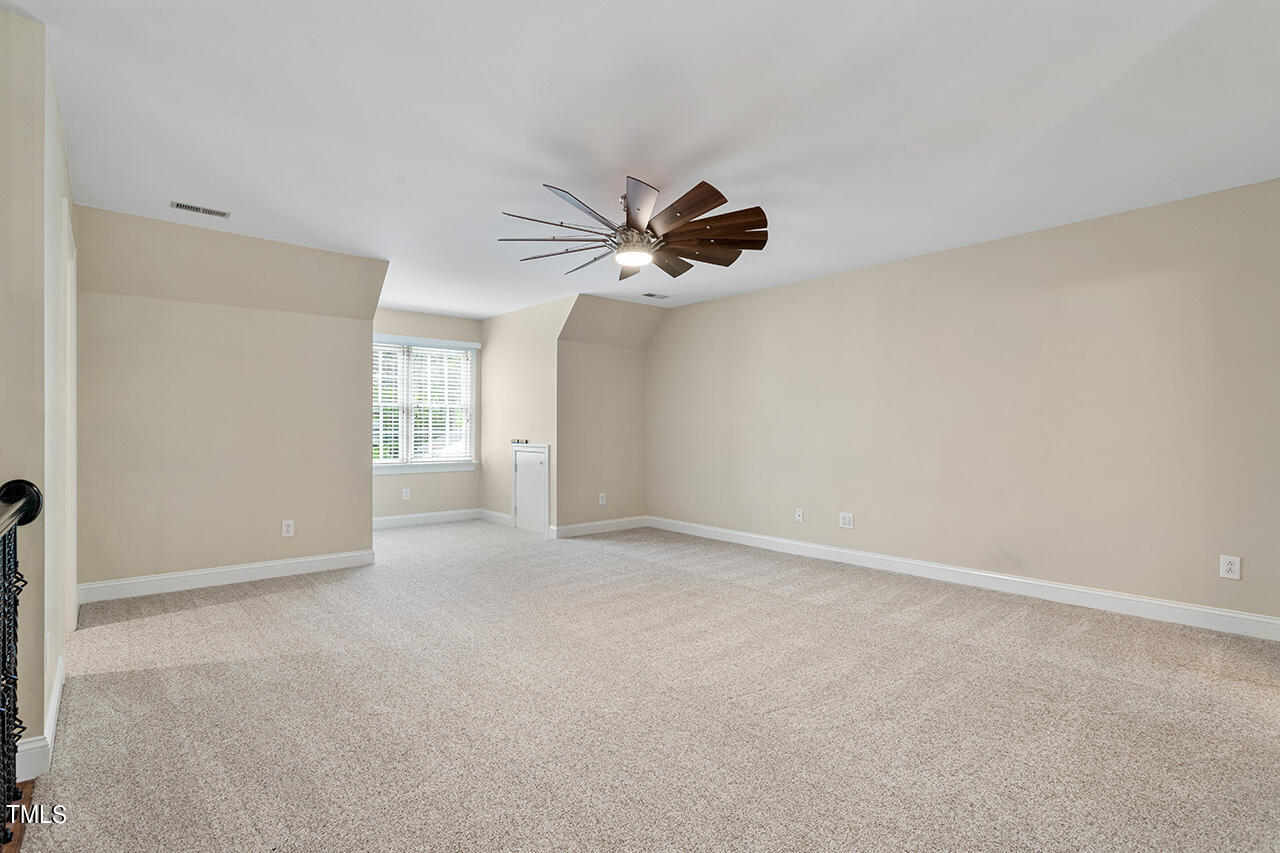 909 Rockfall Court Raleigh, NC 27614 - Photo 23 of 38 a view of an empty room with a window