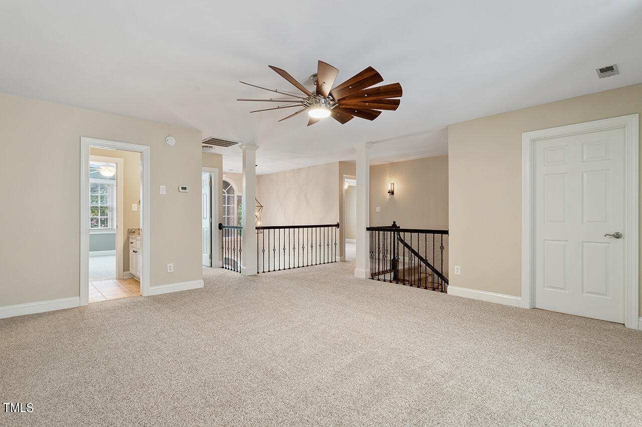 909 Rockfall Court Raleigh, NC 27614 - Photo 24 of 38 a view of empty room with ceiling fan