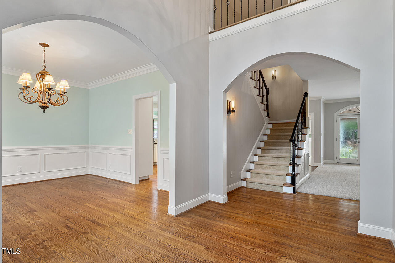 909 Rockfall Court Raleigh, NC 27614 - Photo 3 of 38 a view of an entryway with wooden floor