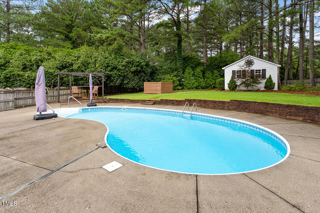 909 Rockfall Court Raleigh, NC 27614 - Photo 32 of 38 a view of a house with a swimming pool