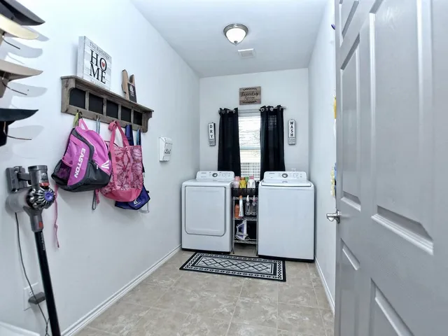 a kitchen with granite countertop a sink stainless steel appliances and cabinets
