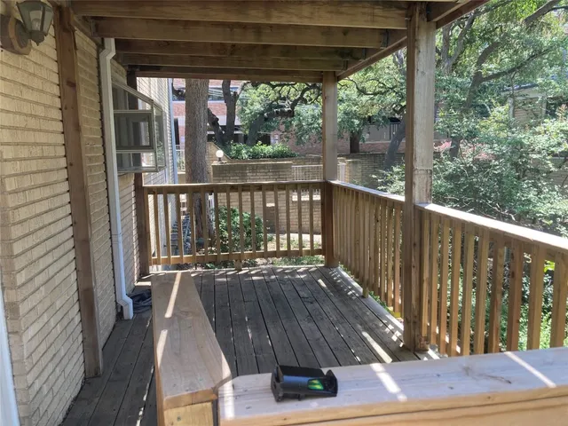 a view of balcony with wooden floor