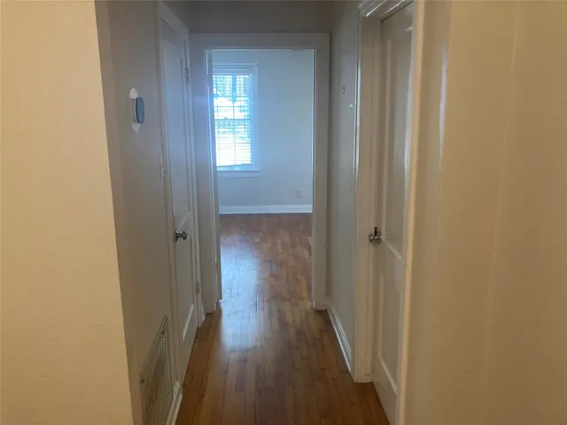 a kitchen with granite countertop a sink stove and cabinets