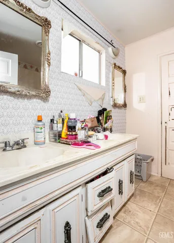 a bathroom with a sink and a mirror
