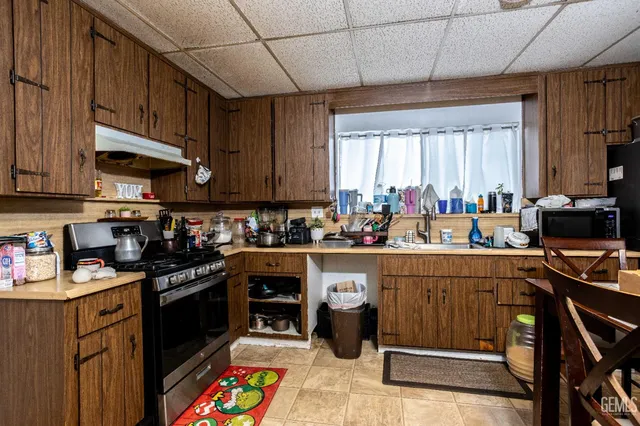 a kitchen with lots of counter top space and appliances