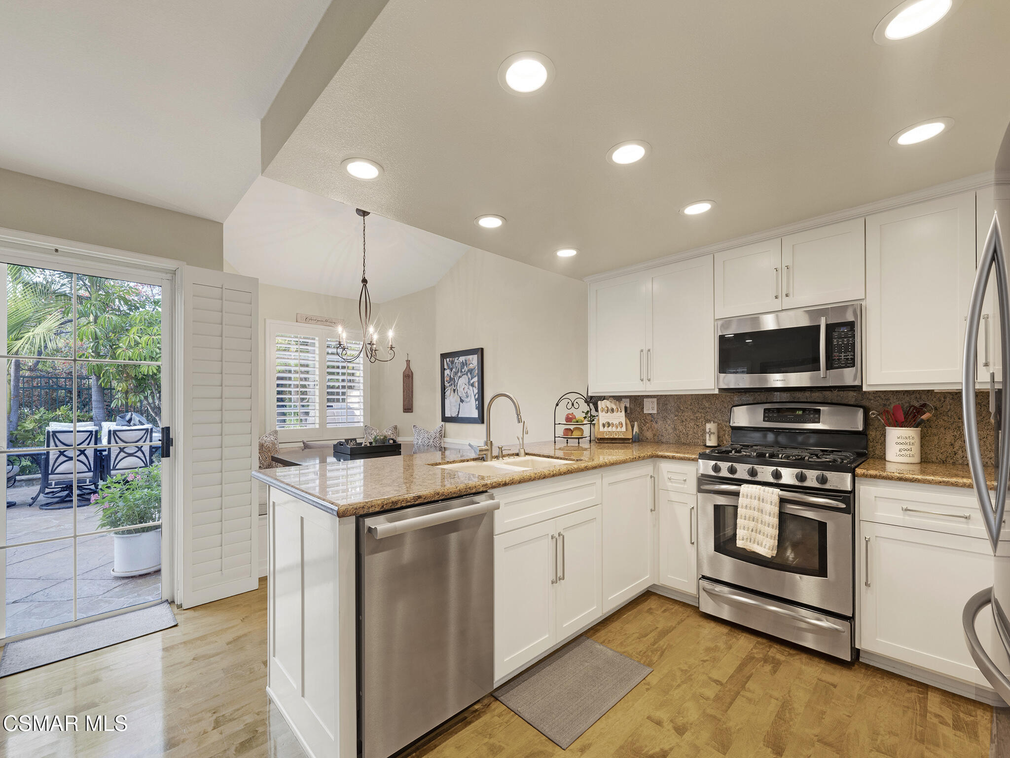 625 Sedgeworth Court Simi Valley, CA 93065 - Photo 11 of 44 a kitchen with stainless steel appliances granite countertop a sink stove and cabinets