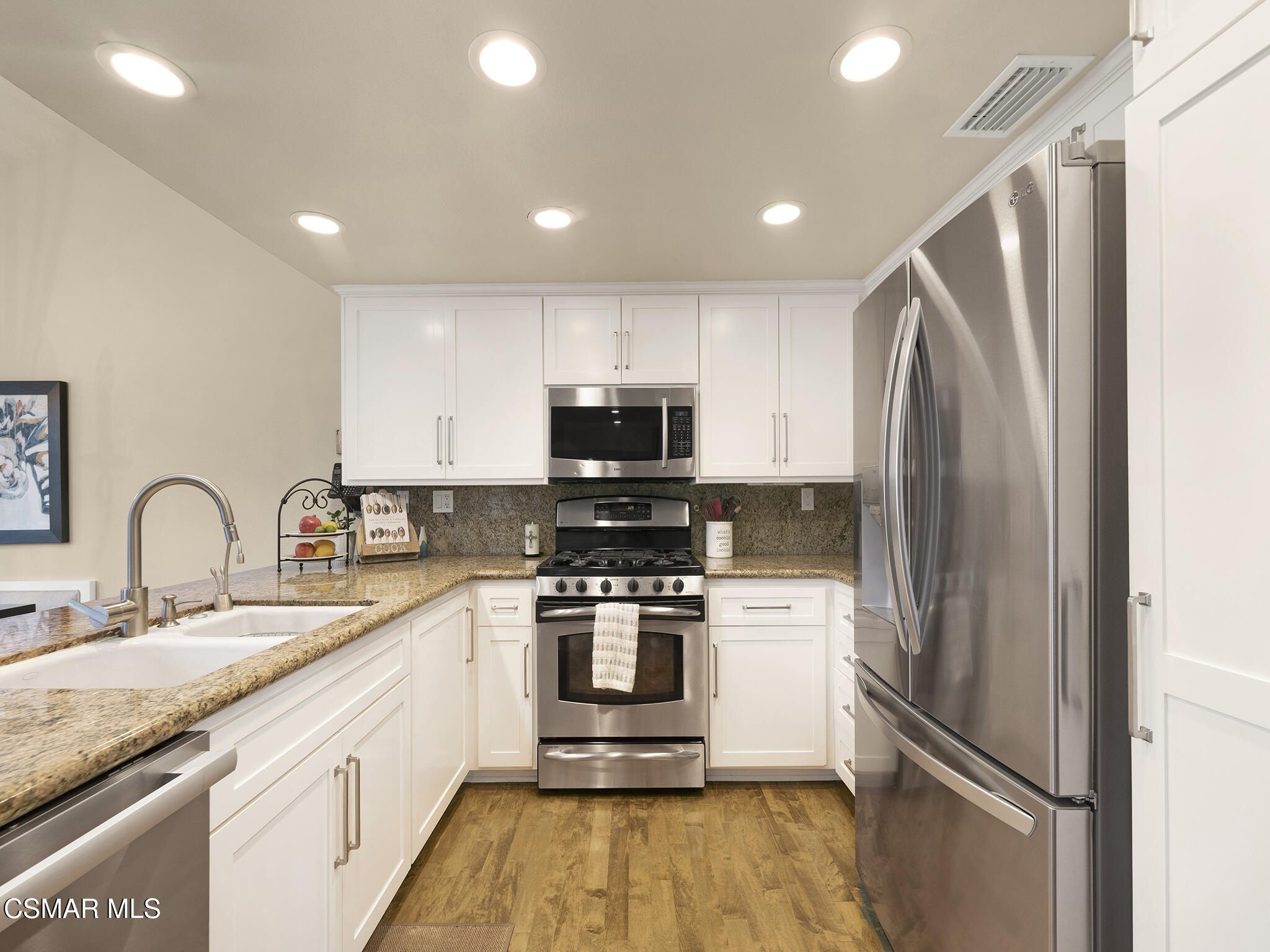 625 Sedgeworth Court Simi Valley, CA 93065 - Photo 12 of 44 a kitchen with stainless steel appliances granite countertop a refrigerator sink and stove