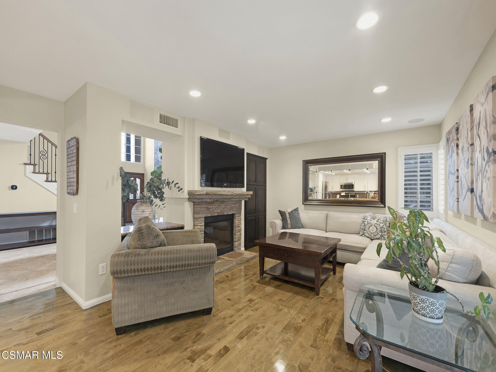 625 Sedgeworth Court Simi Valley, CA 93065 - Photo 16 of 44 a living room with furniture a fireplace and a flat screen tv