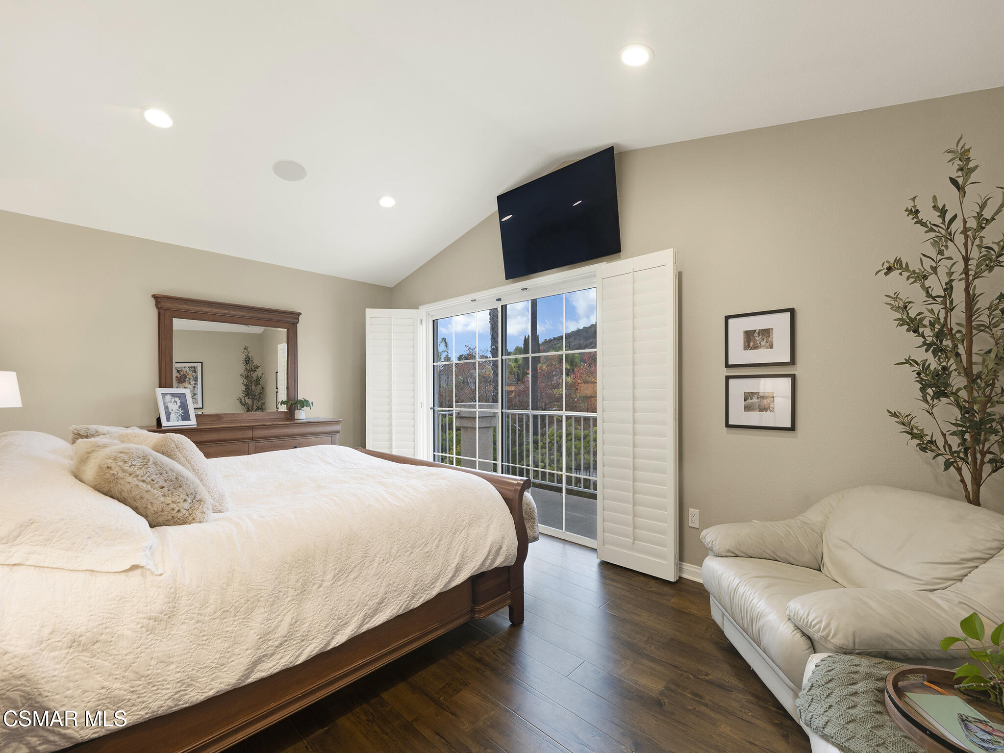 625 Sedgeworth Court Simi Valley, CA 93065 - Photo 21 of 44 a bedroom with a bed a couch and a flat tv screen on the dresser