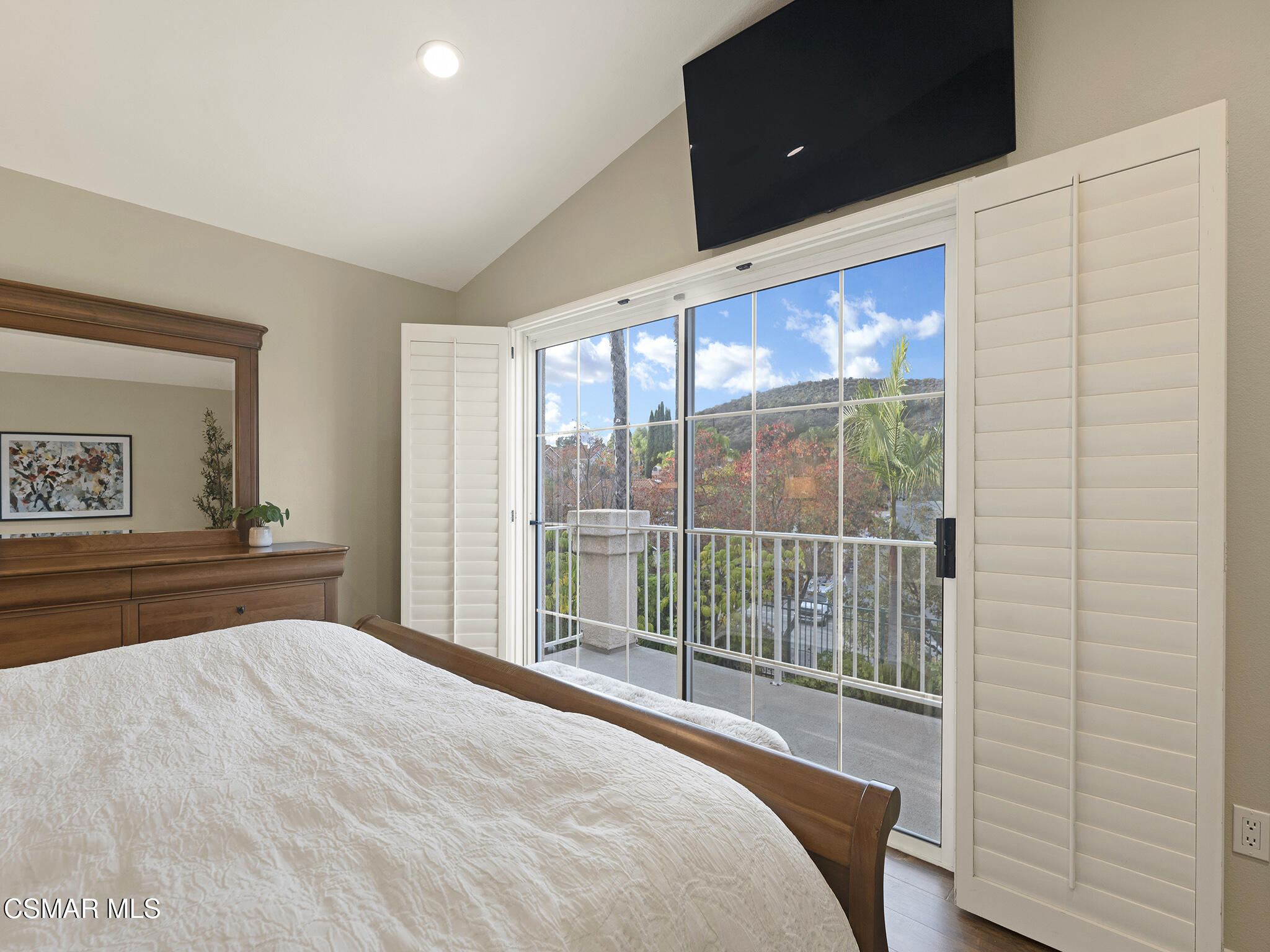 625 Sedgeworth Court Simi Valley, CA 93065 - Photo 22 of 44 a bedroom with a bed and a flat tv screen next to a window