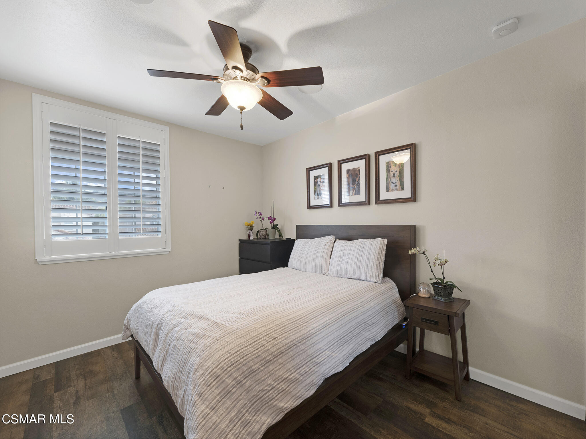 625 Sedgeworth Court Simi Valley, CA 93065 - Photo 28 of 44 a bedroom with a large bed and a chandelier