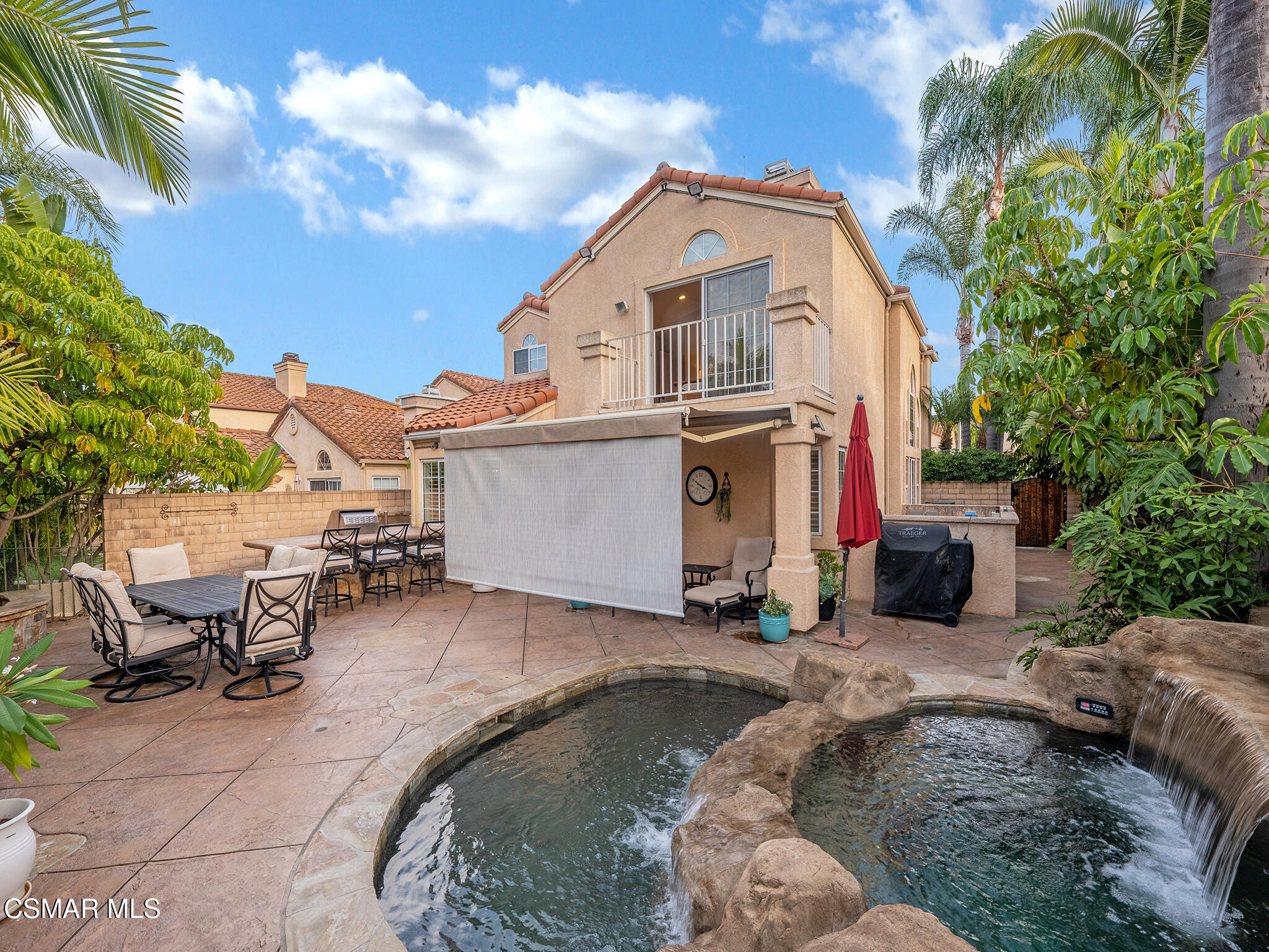 625 Sedgeworth Court Simi Valley, CA 93065 - Photo 39 of 44 a view of a white house with a chairs in patio