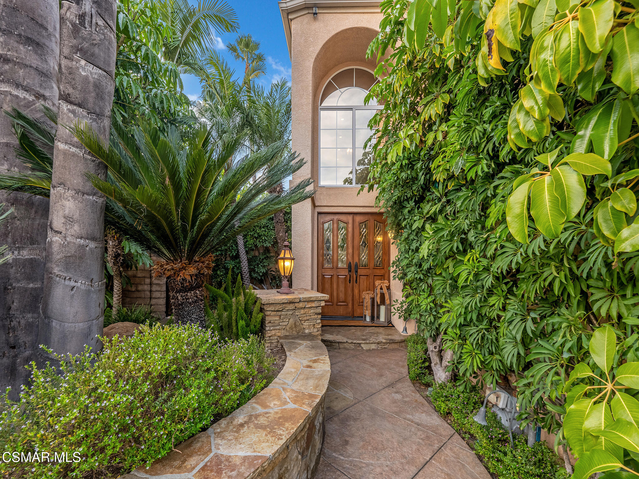 625 Sedgeworth Court Simi Valley, CA 93065 - Photo 4 of 44 a front view of a house with a yard and fountain