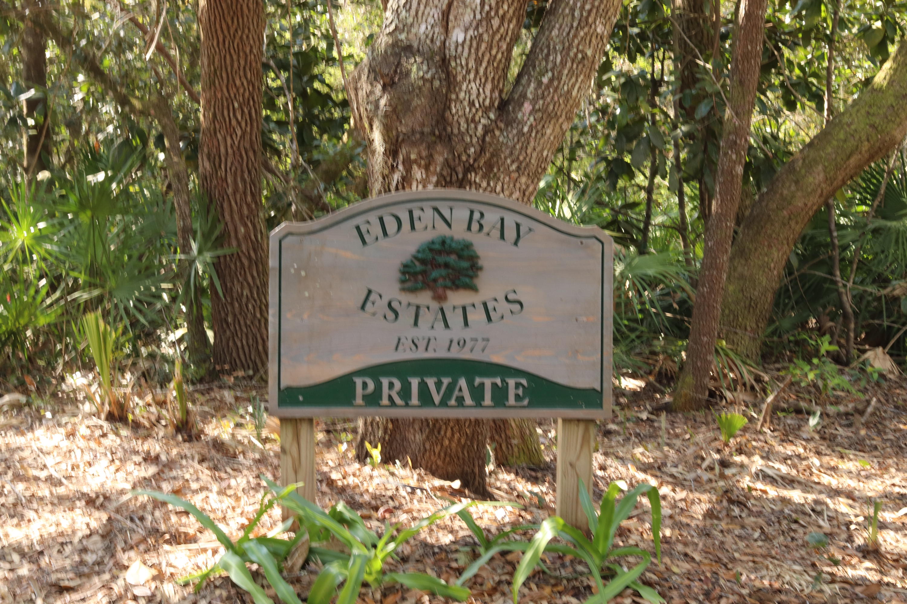 Lot 9 Adair Lane Santa Rosa Beach, FL 32459 - Photo 8 of 23 a sign that is sitting in front of a tree