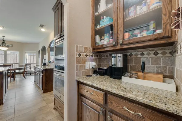 a kitchen with large counter top space and stainless steel appliances