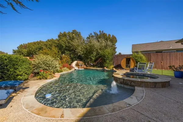 a view of a swimming pool with a patio