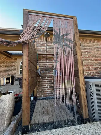 a view of a two chairs in the balcony