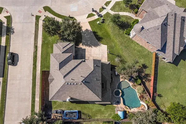 an aerial view of houses with outdoor space