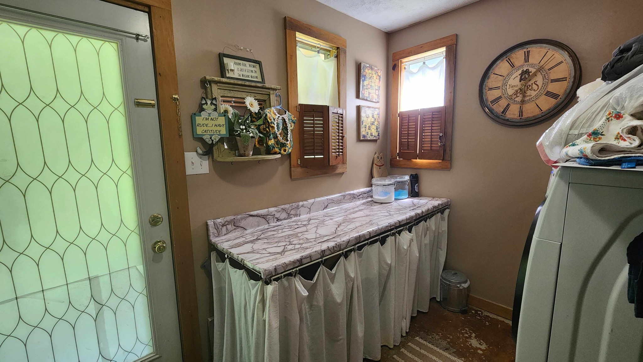 340 Christian Community Road Livingston, TN 38570 - Photo 23 of 79 a bathroom with a granite countertop sink a clock and window