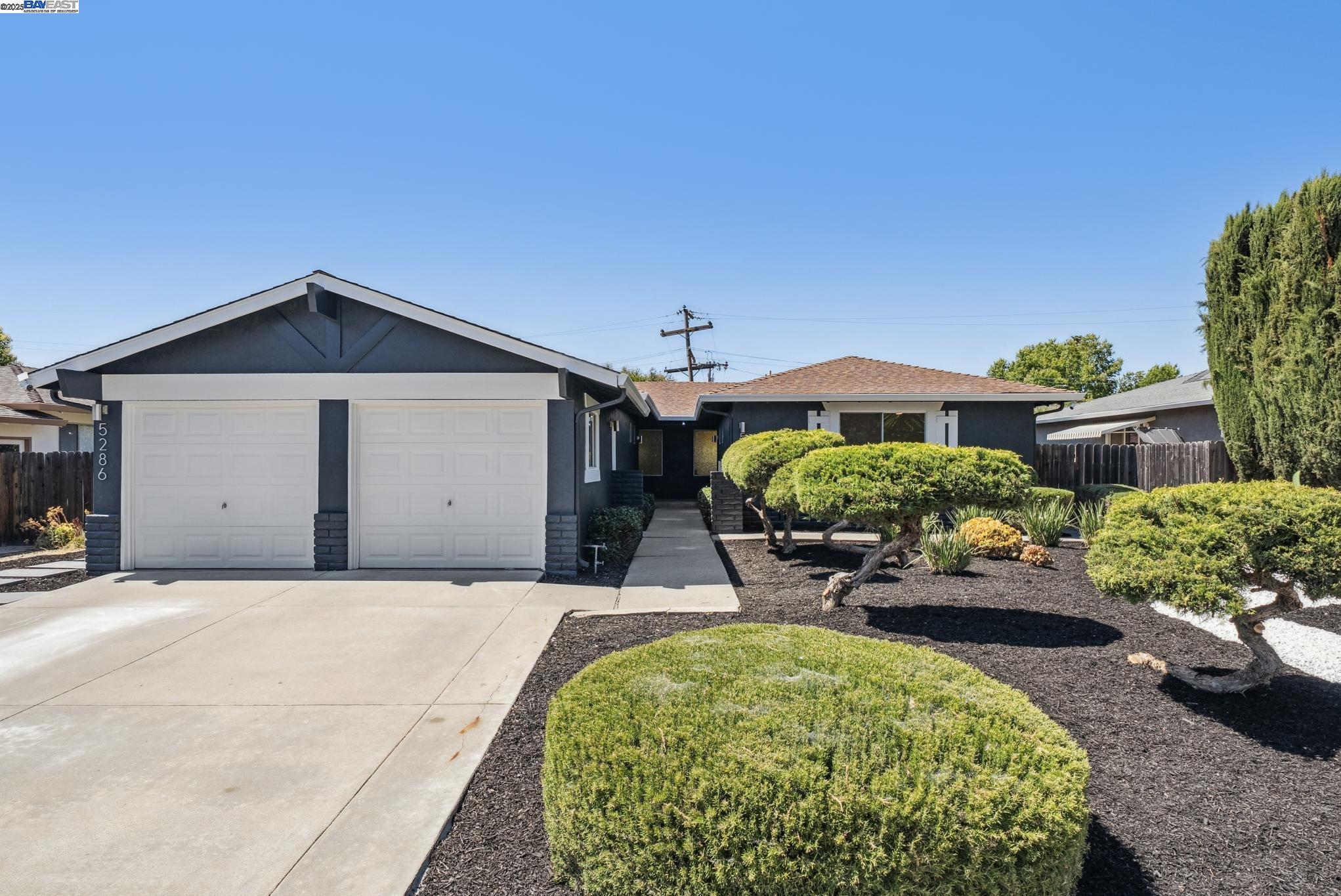 5286 Norma Way Livermore, CA 94550 - Photo 1 of 1 a front view of a house with a yard and potted plants