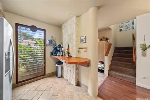 a view of a livingroom with furniture and an empty room