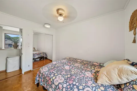 a bedroom with a bed and a dresser