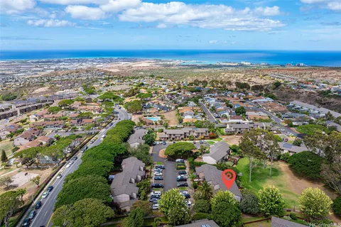 an aerial view of residential building and green space