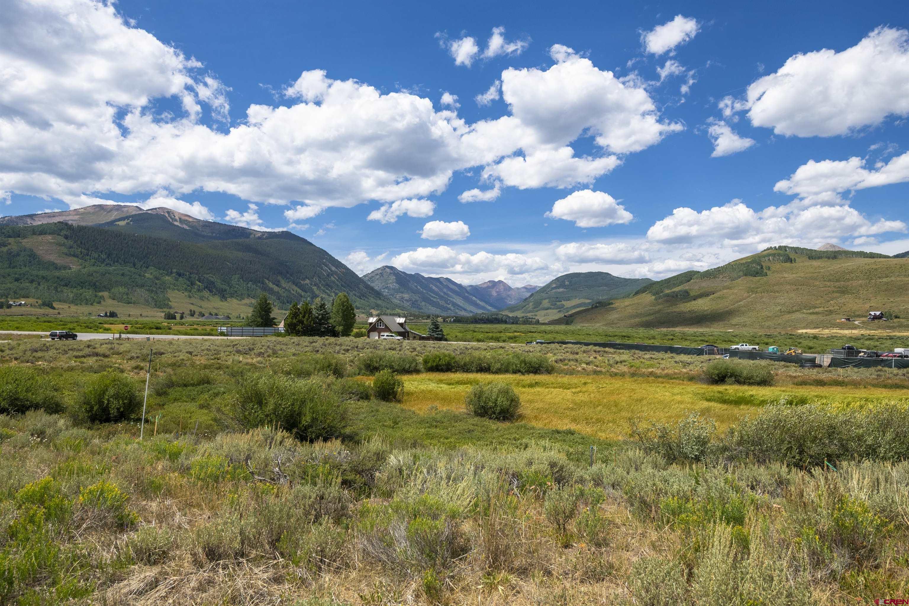 57 Augusta Drive Crested Butte, CO 81224 - Photo 18 of 33 a view of a lake with houses in back