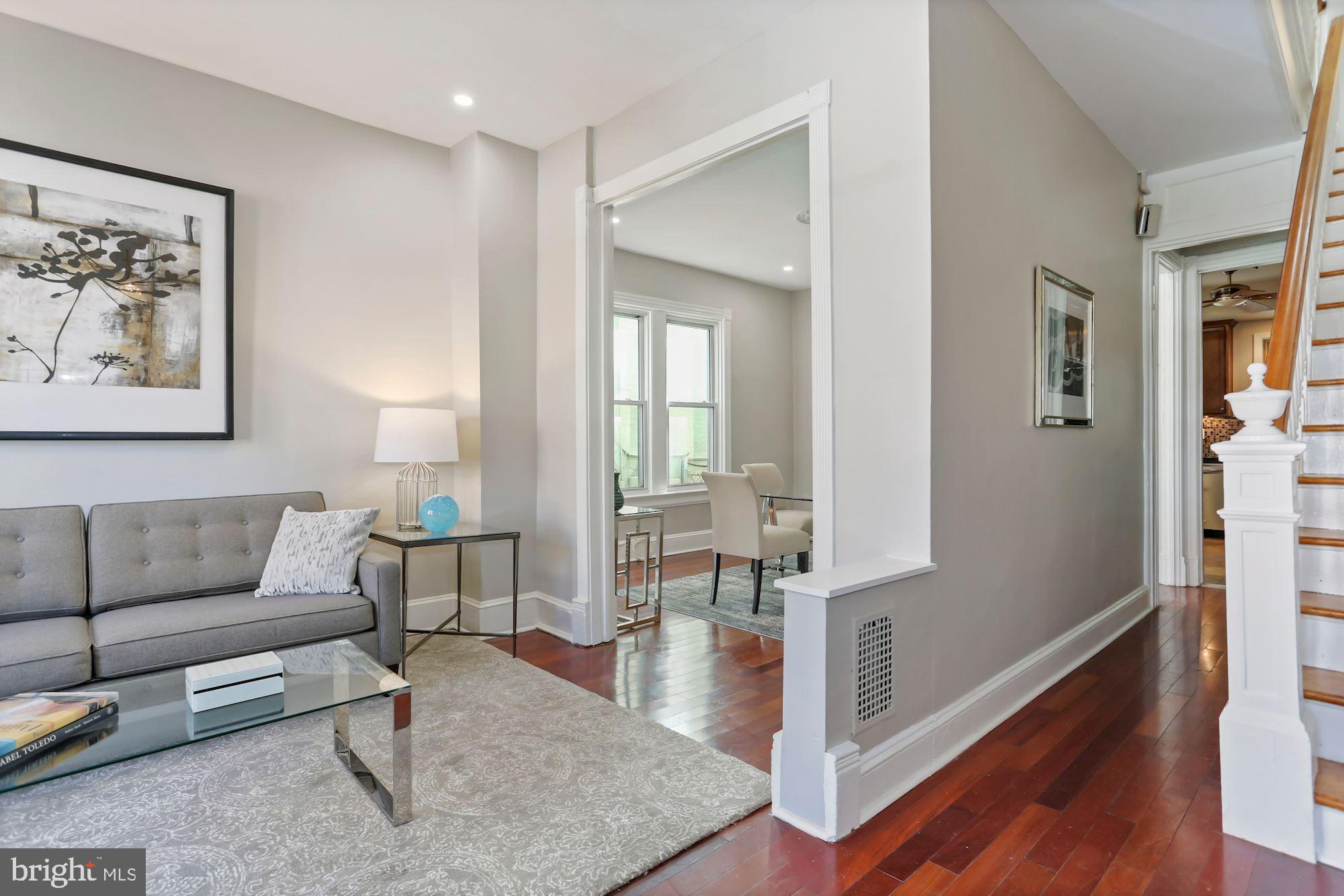 736 Gresham Place Northwest Washington, DC 20001 - Photo 3 of 23 Entryway with Staircase and Living/Dining Area