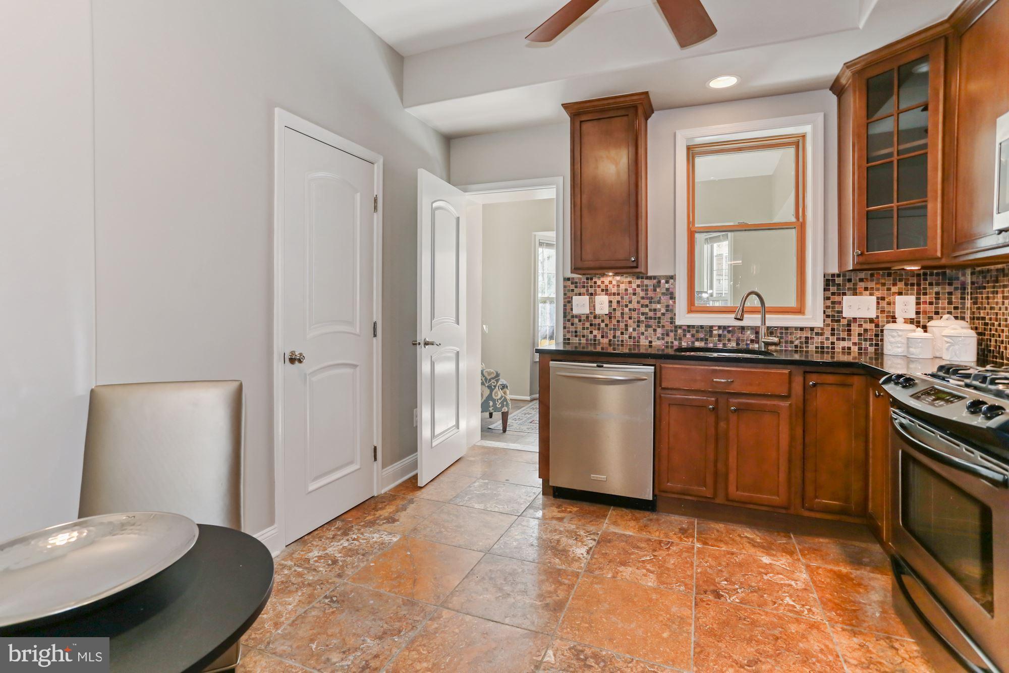 736 Gresham Place Northwest Washington, DC 20001 - Photo 7 of 23 Eat-In Kitchen Leading to Sunroom
