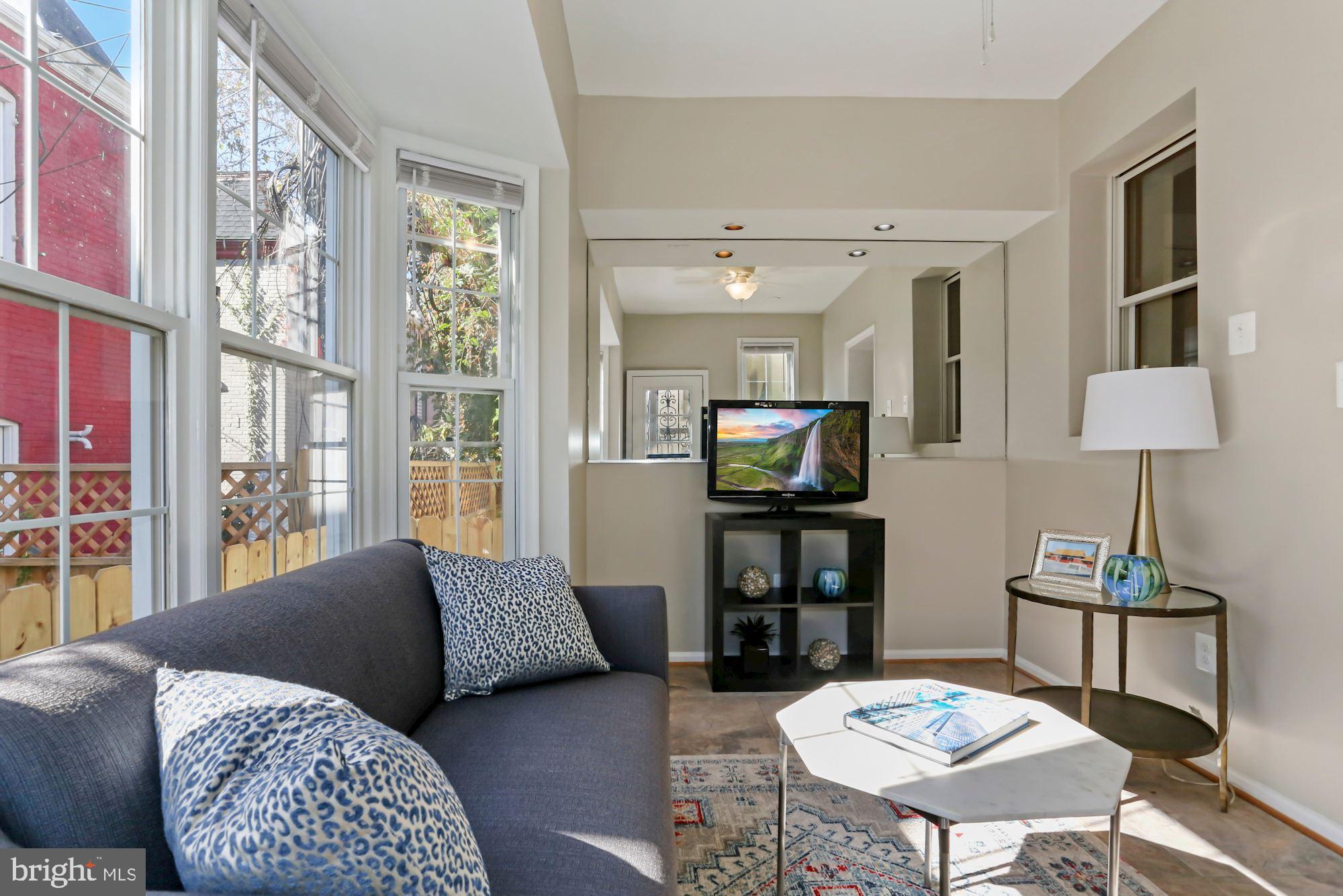736 Gresham Place Northwest Washington, DC 20001 - Photo 10 of 23 Warm and Inviting Sunroom with Large Windows