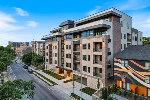 a front view of a building with glass windows