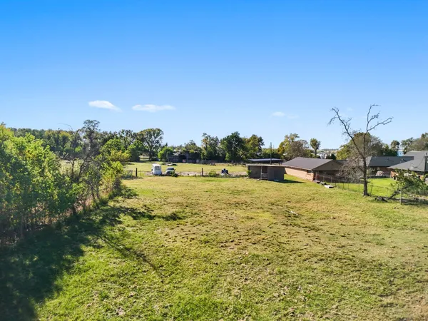 a view of a lake with a big yard