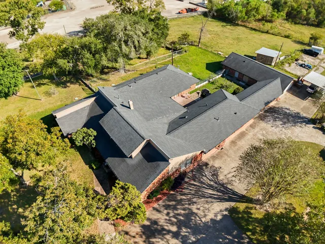 an aerial view of a house with a ocean view