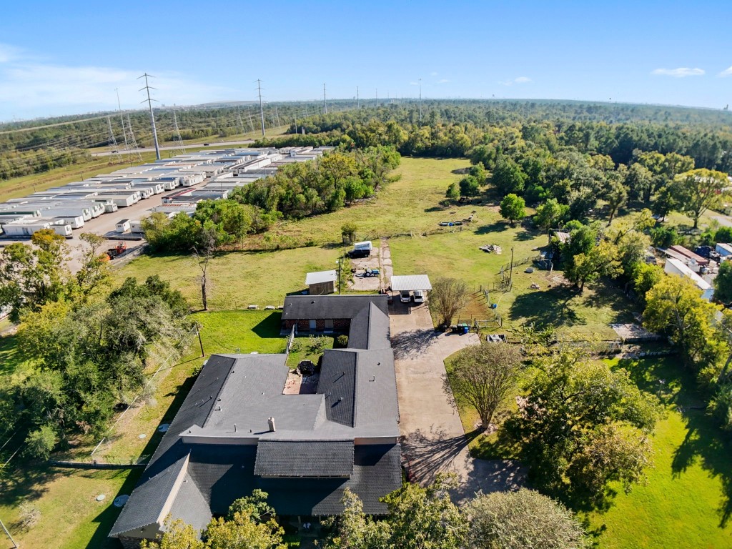 11318 Wallisville Road Houston, TX 77013 - Photo 27 of 42 an aerial view of house with yard swimming pool and outdoor seating