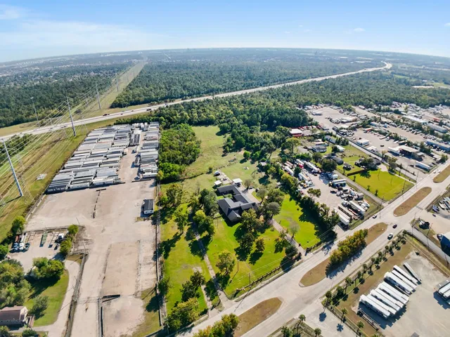 an aerial view of residential houses with outdoor space