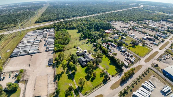 a front view of a house with a yard and porch