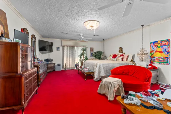 a bedroom with two beds and a bed