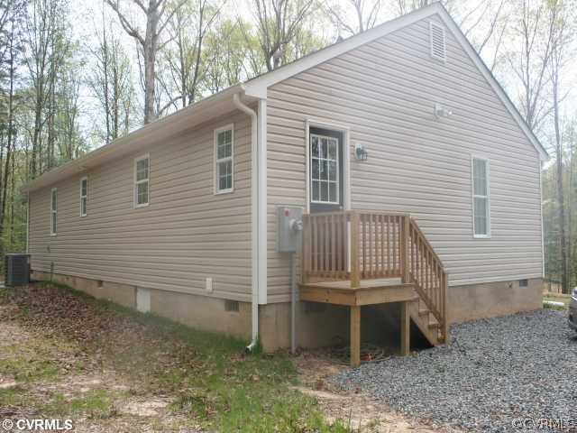 19 Winding Ridge Way Bumpass, VA 23024 - Photo 3 of 12 a view of a house with a yard and garage