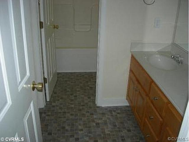 19 Winding Ridge Way Bumpass, VA 23024 - Photo 5 of 12 a bathroom with a sink and a mirror