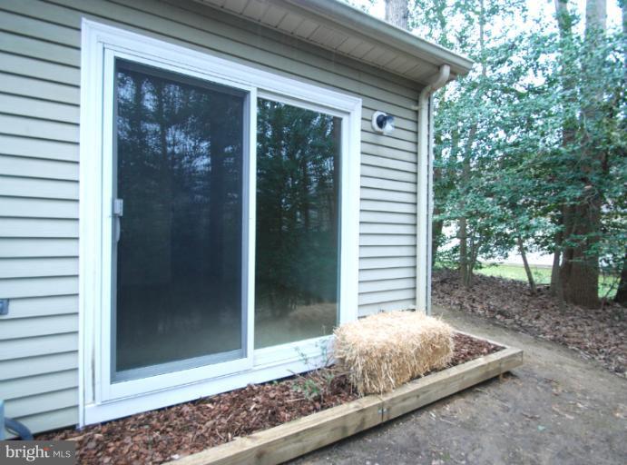 984 Riversedge Circle Annapolis, MD 21401 - Photo 11 of 14 a front view of a house with a yard