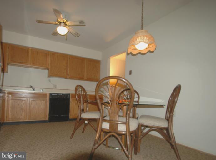 984 Riversedge Circle Annapolis, MD 21401 - Photo 5 of 14 a view of a dining room with furniture and chandelier